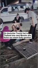 Deutscher Tourist befreit Katze in Thailand aus Gully