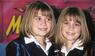 Mary-Kate und Ashley Olsen posieren auf dem roten Teppich.