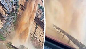 Vorhang aus Schlamm: Fahrer durchquert reißenden Wasserfall auf Bergstraße in China