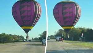 Haarscharf über den Autos: Heißluftballon schwebt über Highway