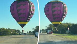 Haarscharf über den Autos: Heißluftballon schwebt über Highway